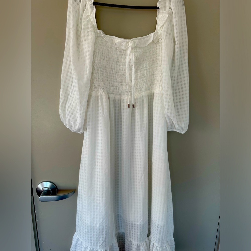 Medium size dress,white in colour
